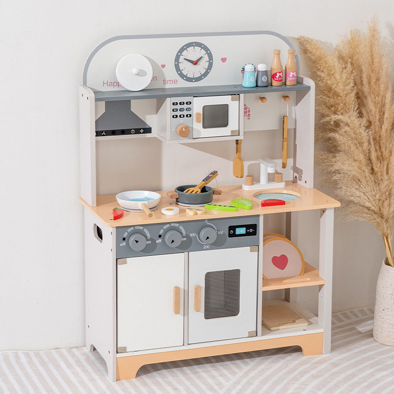 A beautifully crafted wooden toy kitchen in a child's playroom, with wooden food accessories