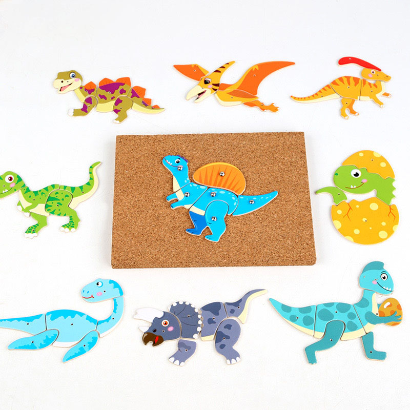 A toddler's hand successfully placing the final piece in a 4-piece wooden farm animal puzzle.