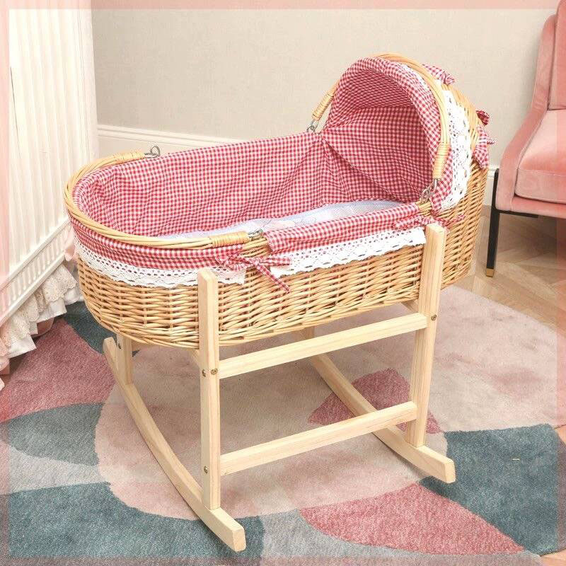 A shaky, ill-fitting Moses basket on a stand highlighted with a warning symbol