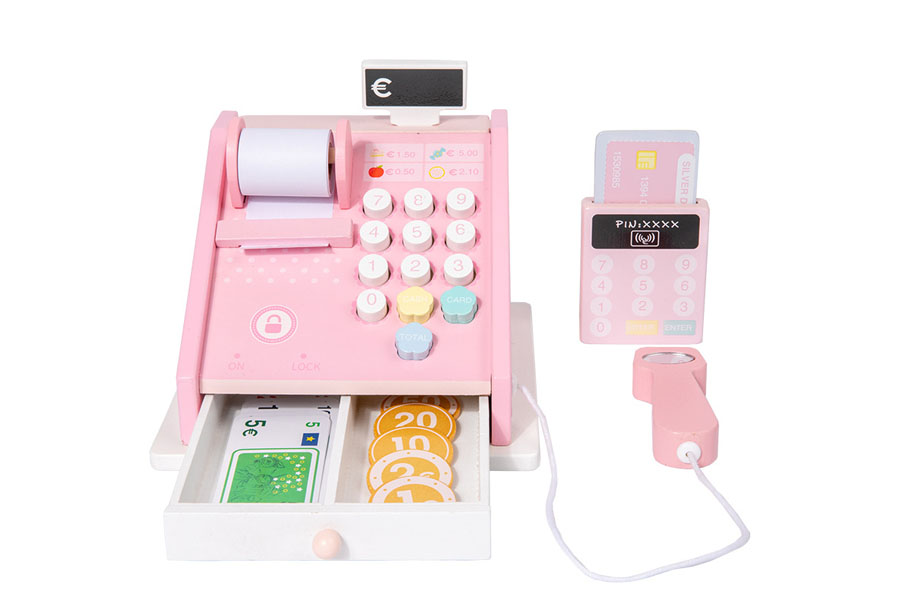 A child happily playing with a colorful wooden cash register in a playroom.