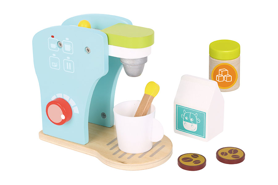 A stylish, gender-neutral wooden toy kitchen in white and natural wood finish in a modern living room.