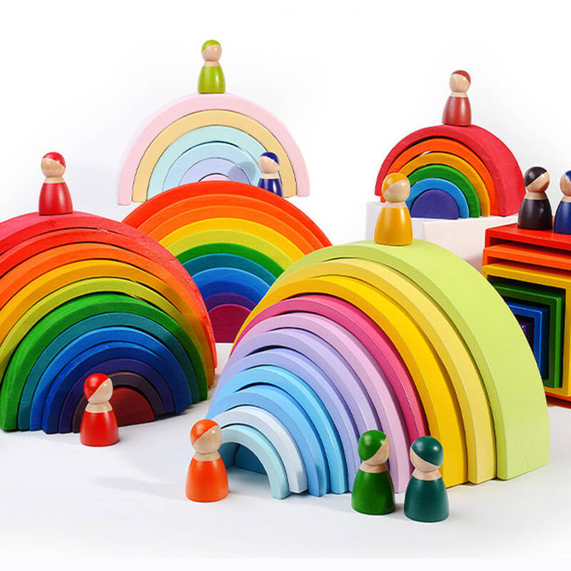 A side-by-side comparison of a Montessori cylinder block and a Waldorf-style rainbow stacker