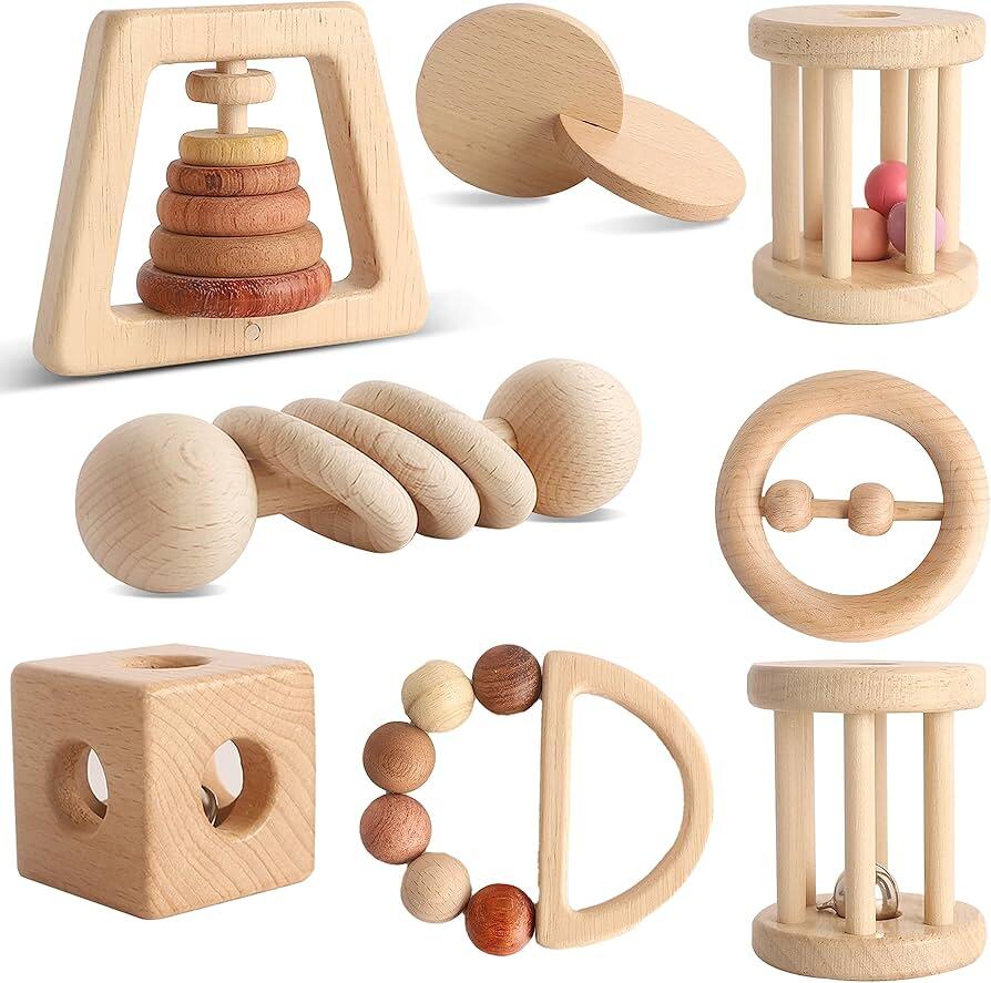 A collection of wooden sensory toys suitable for different ages, arranged from simple infant graspers to more complex toddler puzzles.